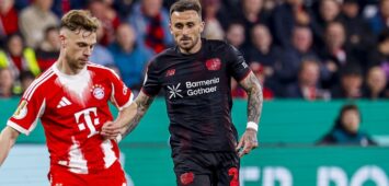 Joshua Kimmich of FC Bayern Munchen passes the ball under pressure from Aleix Garcia of Bayer 04 Leverkusen Bayer 04 Leverkusen v FC Bayern Munchen, DFB Cup Semifinal, Bayer 04 Leverkusen v FC Bayern Munchen, BayArena, April 22, 2026, Leverkusen, Germany.
